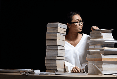 shutterstock_1084179056-asian-woman-mag-stack